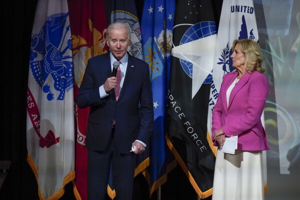 President Joe Biden speaks before a screening of the movie "Wonka" as first lady Jill Biden looks on in Norfolk, Va., Sunday, Nov. 19, 2023. The film is about the early life of Roald Dahl's eccentric chocolatier, Willy Wonka. (AP Photo/Manuel Balce Ceneta)