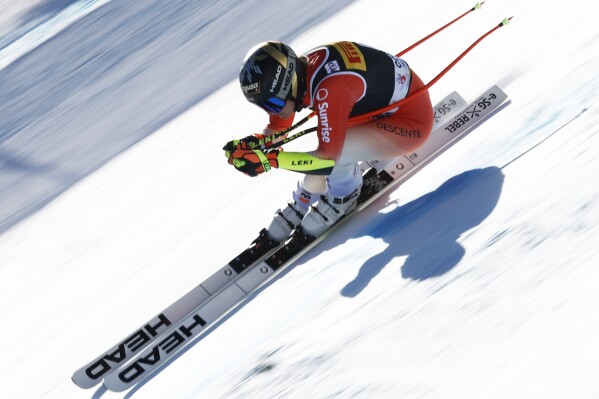 Switzerland's Lara Gut Behrami speeds down the course during an alpine ski, women's World Cup super G race, in Cortina d'Ampezzo, Italy, Sunday, Jan. 28, 2024. (AP Photo/Gabriele Facciotti)