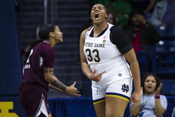 Notre Dame's Lauren Ebo (33) celebrates after scoring and being fouled, as Mississippi State's JerKaila Jordan, left, reacts to the call during the first half of a second-round college basketball game in the women's NCAA Tournament, Sunday, March 19, 2023, in South Bend, Ind. (AP Photo/Michael Caterina)