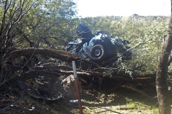 
              In this Oct. 18, 2018, photo provided by the Arizona Department of Public Safety is the scene where authorities say they rescued a seriously injured woman who spent six days in the desert after crashing her car near Wickenburg, Ariz. The Department of Public Safety said Wednesday, Oct. 31, 2018, that rescuers found the severely dehydrated 53-year-old woman on Oct. 18 after following the vehicle's tracks. A maintenance crew and a rancher spotted the car while working along a highway several miles from the historic Western town of Wickenburg. (Arizona Department of Public Safety via AP)
            