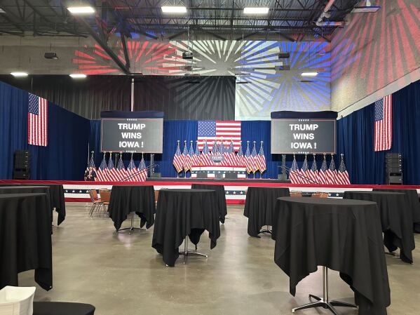 Tables stand empty as former President Donald Trump is declared winner of the Republican caucus at a victory party in Des Moines, Iowa on Monday. (AP Photo/Hannah Fingerhut)