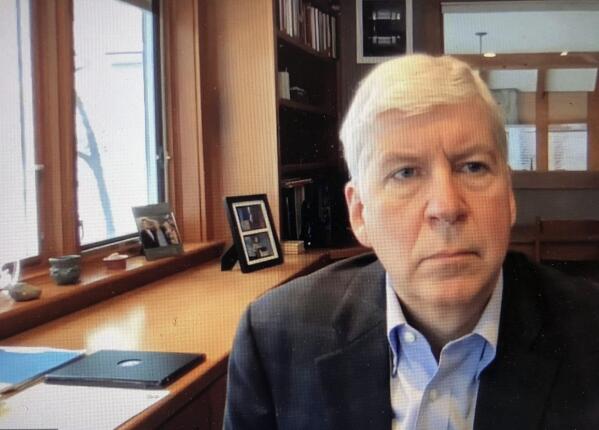 FILE - This screen shot from video, shows former Michigan Gov. Rick Snyder, during his Zoom hearing in the 67th District Court in Flint, Mich., on Jan. 18, 2020. A judge had no authority to issue indictments in the Flint water scandal, the Michigan Supreme Court said Tuesday, June 28, 2022 in an extraordinary decision that wipes out charges against former Gov. Snyder, his health director and seven other people (67th District Court in Flint via AP, file)