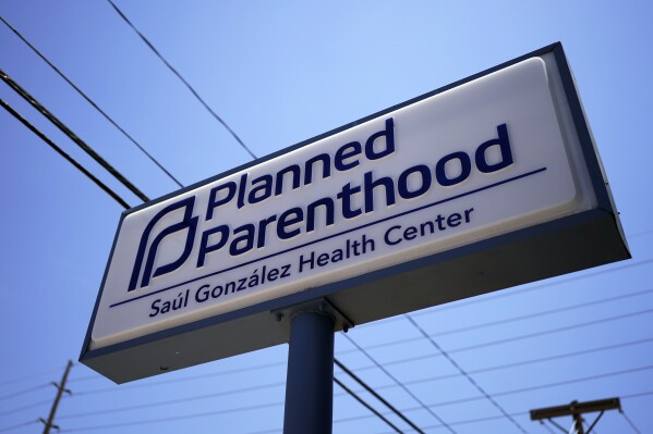 A Planned Parenthood sign is seen in Austin, Texas, Monday, Aug. 14, 2023. A federal judge who ordered restrictions on the abortion pill mifepristone will consider Tuesday, Aug. 15, whether Planned Parenthood must pay potentially hundreds of millions of dollars to the state of Texas over fraud claims. (AP Photo/Eric Gay)