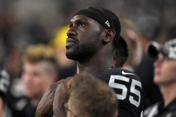 Las Vegas Raiders defensive end Chandler Jones (55) watches from the sideline during the second half of an NFL preseason football game against the New England Patriots, Friday, Aug. 26, 2022, in Las Vegas. (AP Photo/John Locher)