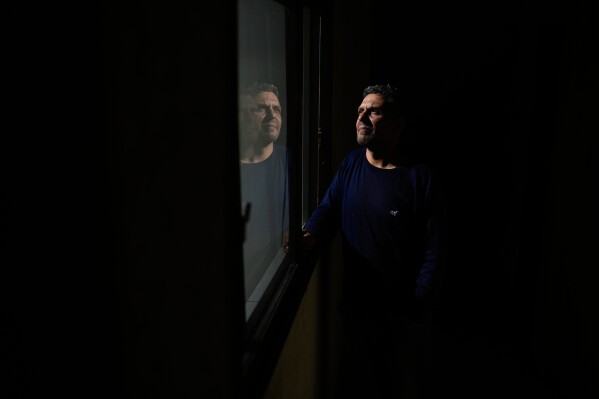 Ariel Wagener, a 47-year-old pizza chef with leukemia who was hospitalized this year with failing kidneys after losing access to his medication, poses for a photo in Buenos Aires, Argentina, Wednesday, April 30, 2025. (AP Photo/Natacha Pisarenko)