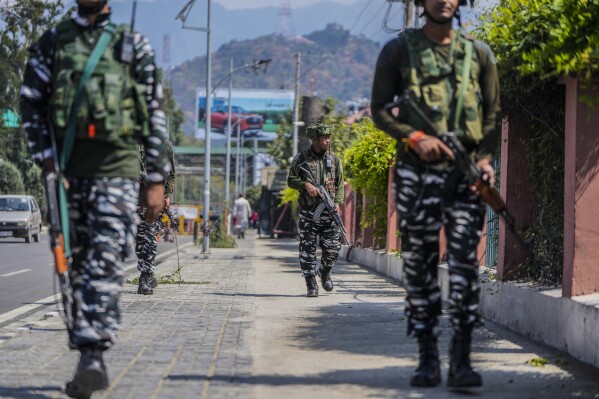 Indian paramilitary soldiers patrol in Srinagar, Indian controlled Kashmir, Tuesday, Sept. 19, 2023. (AP Photo/Mukhtar Khan)