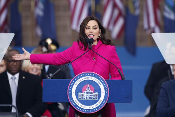 Michigan Gov. Gretchen Whitmer addresses the crowd during inauguration ceremonies, Sunday, Jan. 1, 2023, outside the state Capitol in Lansing, Mich. (AP Photo/Al Goldis)