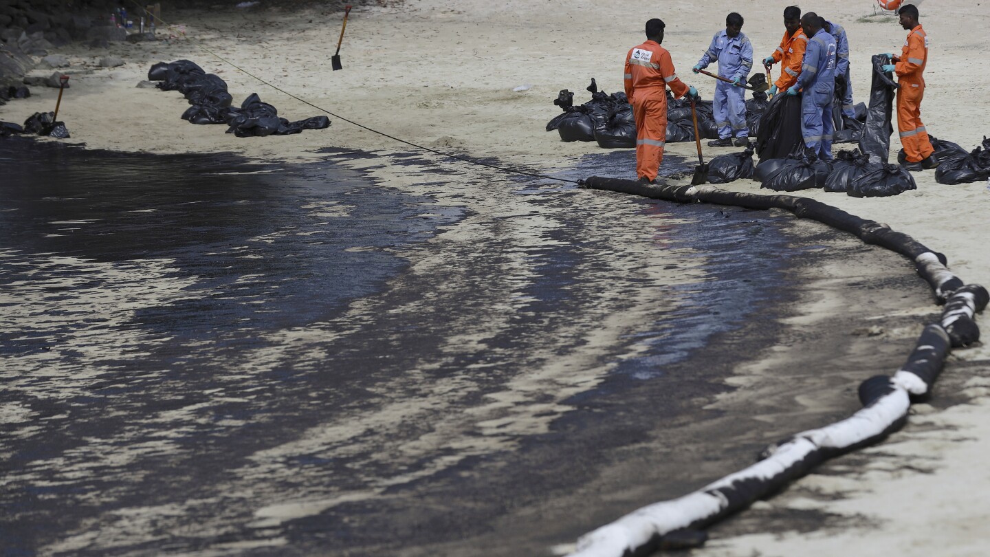 Singapore rushes to clean up oil slick after boat hits stationary fuel supply ship