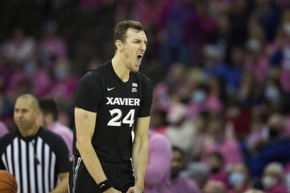 Xavier's Jack Nunge (24) reacts after scoring against Creighton during the second half of an NCAA college basketball game Saturday, Jan. 29, 2022, in Omaha, Neb. Xavier defeated Creighton 74-64. (AP Photo/Rebecca S. Gratz)