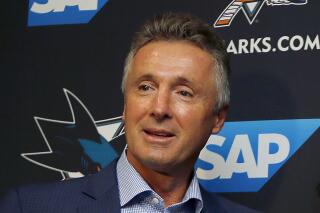 FILE -  San Jose Sharks general manager Doug Wilson is shown during a news conference in San Jose, Calif., Sept. 19, 2018. San Jose Sharks general manager Doug Wilson is stepping down after 19 seasons on the job. The team announced Thursday, April 7, 2022, that Joe Will remains interim GM until a full-time replacement can be found. Will has been running the team’s hockey operations since Wilson went on medical leave in late November. (AP Photo/Josie Lepe, File)