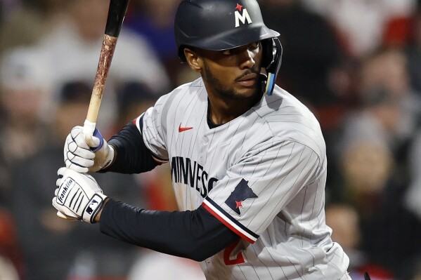 FILE - Minnesota Twins' Michael A. Taylor takes an at-bat during the sixth inning of a baseball game against the Boston Red Sox, April 18, 2023, in Boston. Taylor agreed to a one-year, $4-million deal with the Pittsburgh Pirates, Friday, March 15, 2024, a person with knowledge of the agreement told The Associated Press. The person spoke on condition of anonymity because the deal will not be completed until Taylor passes a physical. (AP Photo/Michael Dwyer, File)