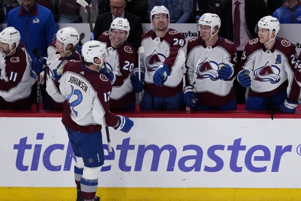 Colorado Avalanche center Ryan Johansen (12) celebrates with teammates after scoring during the second period of an NHL hockey game against the Chicago Blackhawks in Chicago, Thursday, Feb. 29, 2024. (AP Photo/Nam Y. Huh)