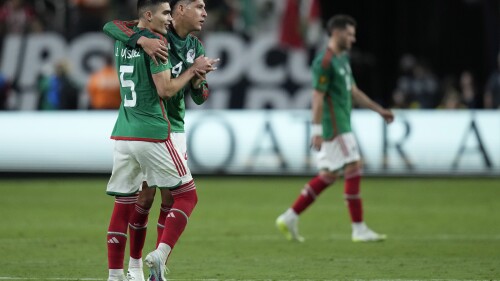 Mexico's Juan Vazquez and Edson Alvarez embrace after beating Jamaica in the Gold Cup semifinals in Las Vegas, Wednesday, July 12, 2023 (AP Photo/John Locher)
