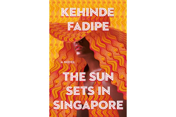 This cover image released by Grand Central Publishing shows "The Sun Sets in Singapore" by Kehinde Fadipe. (Grand Central Publishing via AP)