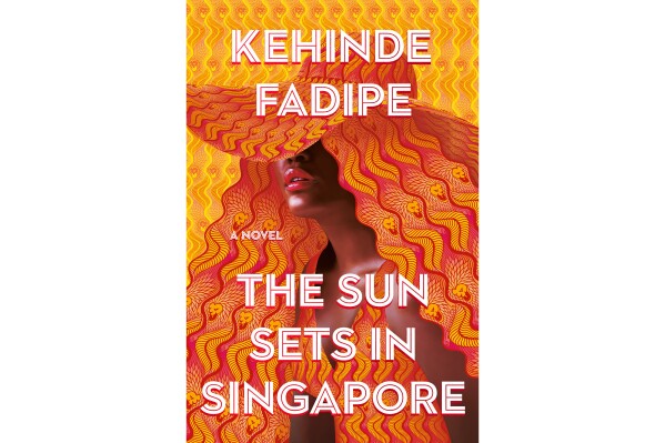 This cover image released by Grand Central Publishing shows "The Sun Sets in Singapore" by Kehinde Fadipe. (Grand Central Publishing via AP)