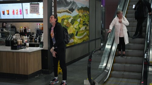 Breanna Stewart, left, of the New York Liberty WNBA basketball team waits for coffee after traveling for most of the day at Harry Reid International Airport while traveling with the team Wednesday, June 28, 2023, in Las Vegas. (AP Photo/John Locher)