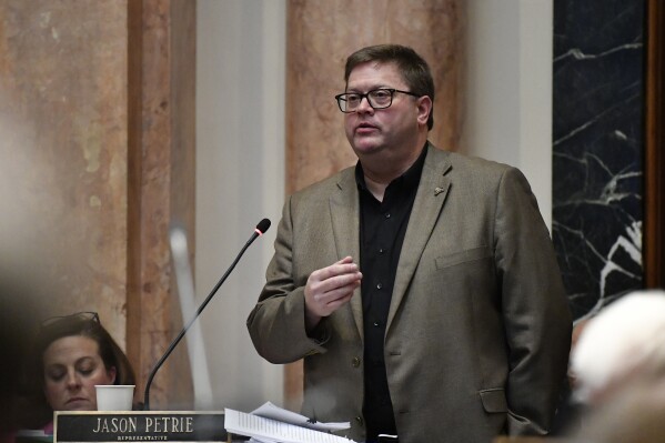 Kentucky state Rep. Jason Petrie responds to questions regarding House Bill 6, the Executive Branch main budget bill during the House session in Frankfort, Ky., Thursday, Feb. 1, 2024. (AP Photo/Timothy D. Easley)