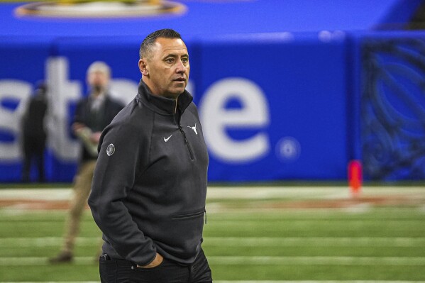 Texas head coach Steve Sarkisian arrives for Texas Media Day ahead of the Sugar Bowl, Saturday, Dec. 30, 2023, in New Orleans, La. Texas will take on Washington on Monday, Jan. 1, 2024. (Aaron E. Martinez/Austin American-Statesman via AP)