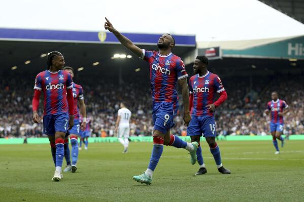 Crystal Palace's Jordan Ayew, centre, celebrates after scoring his side's second goal, during the English Premier League soccer match between Leeds United and Crystal Palace at Ellend Road, in Leeds, England, Sunday April 9, 2023. (Nigel French/PA via AP)