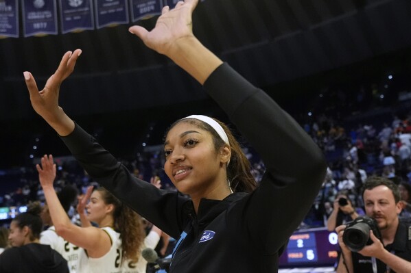 Chicago Sky forward Angel Reese responds to the crowd after a WNBA exhibition basketball game against Brazil in Baton Rouge, La., Friday, May 2, 2025. (AP Photo/Gerald Herbert)