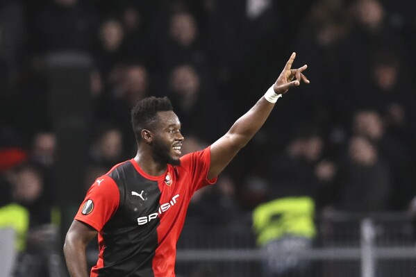 FILE - Rennes' Joris Gnagnon celebrates after scoring his side's second goal during the Europa League Group E soccer match between Rennes and Lazio, at the Roazhon Park stadium in Rennes, France, Thursday, Dec. 12, 2019. Spanish soccer team Sevilla FC said it won a ruling at the Court of Arbitration for Sport that it was justified to terminate Gnagnon's contract in 2021 because he was consistently overweight. Gnagnon had previously asked FIFA for nearly 5 million euros in compensation from Sevilla for the contact termination. (AP Photo/David Vincent, File)
