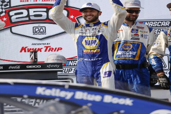 Chase Elliott (9) holds up his trophy after winning a NASCAR Cup Series auto race Sunday, July 4, 2021, at Road America in Elkhart Lake, Wis. (AP Photo/Jeffrey Phelps)