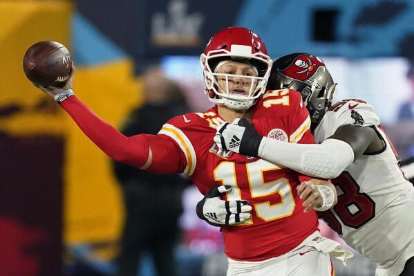 Kansas City Chiefs quarterback Patrick Mahomes passes under pressure from Tampa Bay Buccaneers outside linebacker Shaquil Barrett during the first half of the NFL Super Bowl 55 football game Sunday, Feb. 7, 2021, in Tampa, Fla. (AP Photo/Ashley Landis)