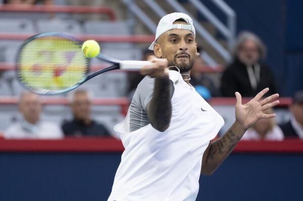 Nick Kyrgios, of Australia, returns to Sebastian Baez, of Argentina, during first round play at the National Bank Open tennis tournament Tuesday Aug. 9, 2022, in Montreal. (Paul Chiasson/The Canadian Press via AP)