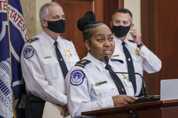FILE - Assistant Chief for Protective and Intelligence Operations Yogananda Pittman, center, flanked by U.S. Capitol Police Chief Tom Manger, left, and Acting Assistant Chief for Uniformed Operations Sean Gallagher, speaks during a news conference to discuss preparations for a weekend rally planned by allies of Donald Trump who support the so-called "political prisoners" of the Jan. 6 attack on the Capitol, Friday, Sept. 17, 2021, at the Capitol in Washington. The University of California, Berkeley, announced Monday, Dec. 5, 2022, that it has hired Pittman as the new chief of campus police. (AP Photo/J. Scott Applewhite, File)