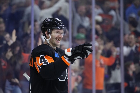 Philadelphia Flyers' Sean Couturier reacts after scoring the game-winning goal during overtime in an NHL hockey game against the Vegas Golden Knights, Saturday, Nov. 18, 2023, in Philadelphia. (AP Photo/Matt Slocum)