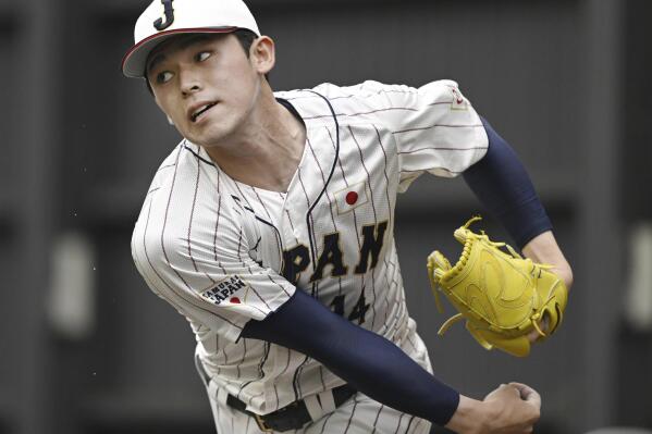 Japanese pitcher Roki Sasaki works out at a team camp of the World Baseball Classic, in Miyazaki, southern Japan, on Feb. 19, 2023. All eyes will be on Japanese baseball pitcher Sasaki at the World Baseball Classic. He is regarded as the next big thing in baseball out of Japan. (Kyodo News via AP)