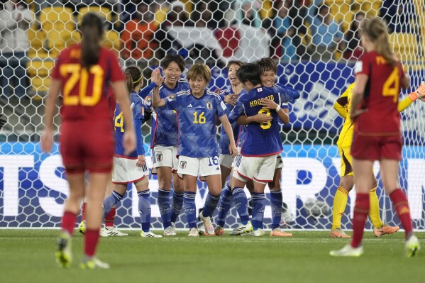 Japan's players celebrate at the end of the the Women's World Cup Group C soccer match between Japan and Spain in Wellington, New Zealand, Monday, July 31, 2023. Japan beat Spain 4-0. (AP Photo/John Cowpland)