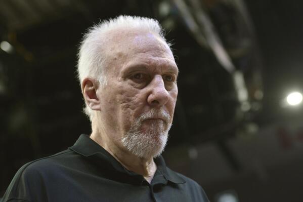 San Antonio Spurs coach Gregg Popovich stands on the court during the first half of the team's NBA basketball game against the Memphis Grizzlies on Monday, Feb. 28, 2022, in Memphis, Tenn. (AP Photo/Brandon Dill)