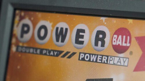 FILE - A display panel advertises tickets for a Powerball drawing at a convenience store, Nov. 7, 2022, in Renfrew, Pa. The Powerball jackpot soared to an estimated $875 million after no winning ticket was sold for the Wednesday, July 12, 2023, drawing. (AP Photo/Keith Srakocic, File)