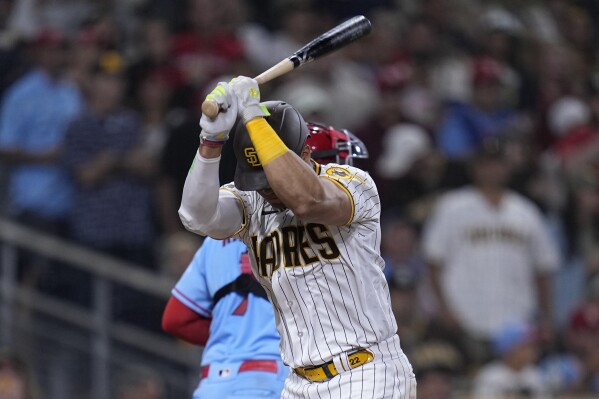 San Diego Padres' Juan Soto throws his bat after striking out to end the ninth inning of a baseball game against the St. Louis Cardinals, Saturday, Sept. 23, 2023, in San Diego. (AP Photo/Gregory Bull)