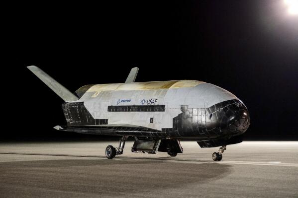 The Boeing-built X-37B Orbital Test Vehicle (OTV) is shown at NASA’s Kennedy Space Center in Florida on Saturday, Nov. 12, 2022. The unmanned U.S. military space plane landed early Saturday after spending a record 908 days in orbit for its sixth mission and conducting science experiments.  The solar-powered vehicle, which looks like a miniature space shuttle, landed at NASA’s Kennedy Space Center. Its previous mission lasted 780 days.   (Boeing /U.S. Space Force via AP)