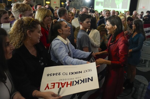 Republican presidential candidate former UN Ambassador Nikki Haley, right, greeting supporters after speaking at an election night event, Saturday, Feb. 24, 2024, in Charleston, S.C. (AP Photo/Chris Carlson)