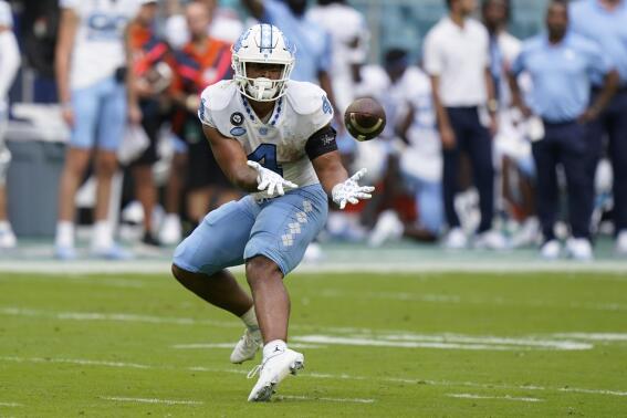 North Carolina running back Caleb Hood catches a pass during the first half of an NCAA college football game against Miami, Saturday, Oct. 8, 2022, in Miami Gardens, Fla. (AP Photo/Wilfredo Lee)
