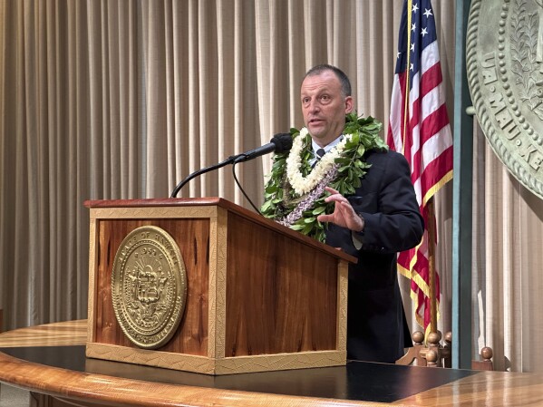 Hawaii Gov. Josh Green speaks to reporters in Honolulu on Monday, Jan. 22, 2024, after delivering his State of the State address at the Hawaii State Capitol. (AP Photo/Audrey McAvoy)