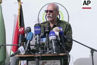 In this image made from video, Brahim Ghali, leader of the pro-independence Polisario Front speaks to a crowd in Tindouf, Algeria, Feb. 27, 2021. The leader of the Polisario Front that leads the struggle for the self-declared Western Sahara republic has been brought to Spain to receive medical treatment, it was announced Thursday, April 22. Brahim Ghali, who is 73, leads the Algeria-backed pro-independence group representing the local Sahrawi population that has fought Moroccan forces for control of the territory in western Africa. Ghali was taken to Spain “for strictly humanitarian reasons," the foreign ministry said. (AP Photo)
