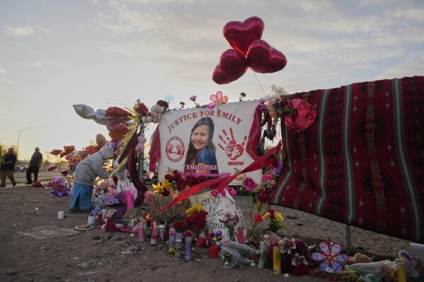 A tribute to slain Native American teen Emily Pike adorns a fence near a vigil in her honor in Mesa, Ariz., Thursday, March 6, 2025. (AP Photo/Samantha Chow, file)