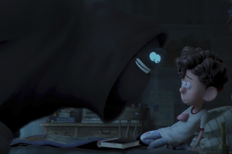 This image released by Netflix shows Orion, voiced by Jacob Tremblay, right, with Dar, voiced by Paul Walter Hauser, in a scene from "Orion and the Dark." (DreamWorks Animation/Netflix via AP)