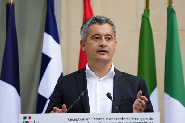 French Interior minister Gerald Darmanin acknowledges members of foreign police forces that help with the security of the 2024 Summer Olympics, Thursday, July 25, 2024, in Paris, France. (ĢӰԺ Photo/Petr David Josek)