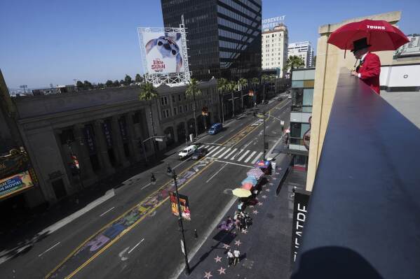 A sign reads "All Black Lives Matter" as part of an art installation Tuesday, May 20, 2025, in the Hollywood section of Los Angeles. (AP Photo/Damian Dovarganes)