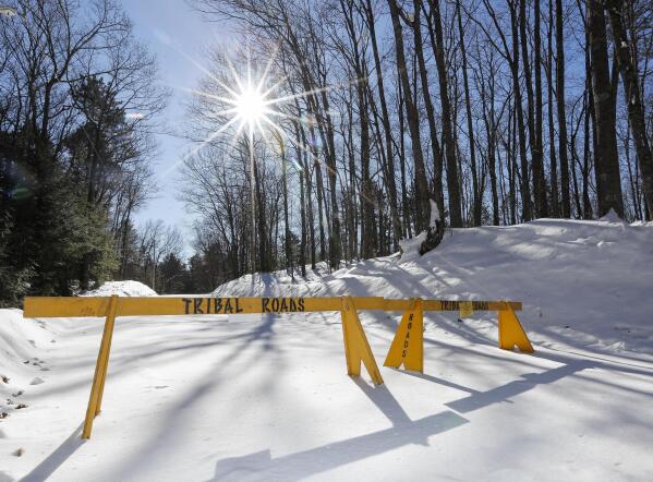 FILE - A roadblock is seen along Center Sugarbush Lane on Feb. 8, 2023, along Elsie Lake Lane in Lac du Flambeau, Wis. A federal judge signaled Wednesday, June 7, 2023, that he likely won't stop a northern Wisconsin tribe from blocking roads on its reservation while non-tribal property owners pursue a lawsuit against the band. (Tork Mason/The Post-Crescent via AP, File)