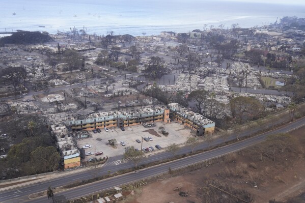 Wildfire wreckage is left behind following a stubborn blaze on Thursday, Aug. 10, 2023, in Lahaina, Hawaii. (AP Photo/Rick Bowmer)