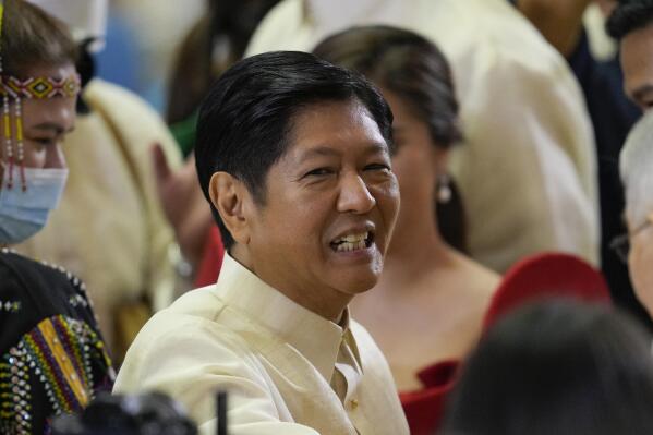 Philippine President Ferdinand Marcos Jr. smiles after he delivers his first state of the nation address in Quezon city, Philippines, Monday, July 25, 2022. Marcos Jr. said it's wrong to describe his late father as a dictator and that his brutal martial law rule in the 1970's was not meant to prolong his grip on power, comments that were immediately rejected by human rights activists. (AP Photo/Aaron Favila-Pool)