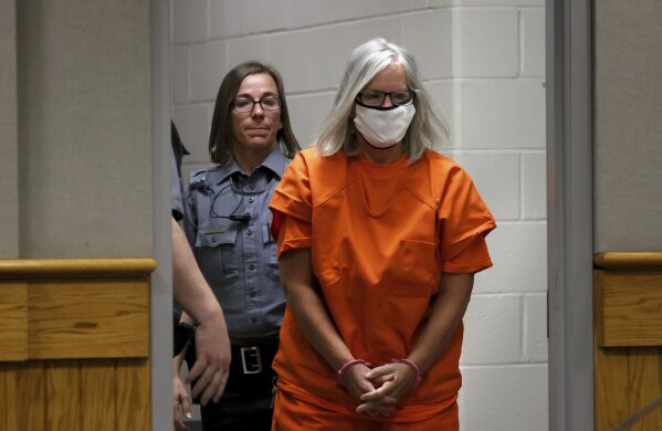 FILE - Pamela Hupp is escorted into the courtroom for a hearing at the Lincoln County Justice Center, Tuesday, July 27, 2021, in Troy, Mo. A Missouri prosecutor, on Friday, Oct. 27, 2023, has dropped and refiled the murder case of Hupp, a killing that inspired a TV miniseries. Lincoln County Prosecuting Attorney Mike Wood charged Hupp with first-degree murder in July 2021, accusing her of killing her friend, Betsy Faria, a decade earlier. (Christian Gooden/St. Louis Post-Dispatch via AP)