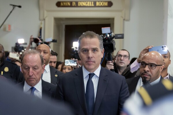 Hunter Biden, President Joe Biden's son, accompanied by his attorney Abbe Lowell, leaves a House Oversight Committee hearing as Republicans are taking the first step toward holding him in contempt of Congress, Wednesday, Jan. 10, 2024, on Capitol Hill in Washington. (AP Photo/Jose Luis Magana)