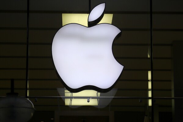 FILE - The Apple logo is illuminated at a store in the city center of Munich, Germany, Dec. 16, 2020. Apple might end up on the hook after all for billions of euros in back taxes to Ireland in the latest twist in a longrunning European Union dispute. That's after a legal opinion Thursday, Nov. 9, 2023 from an adviser to the bloc鈥檚 top court. (APPhoto/Matthias Schrader, File)